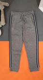 شلوار اسلش تو پنبه ای دخترانه طوسی طرحدار و نوار دوزی شده برند کیدز